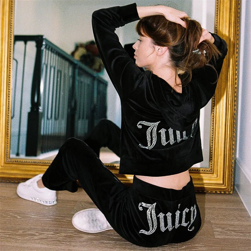 Women's Y2K-inspired two-piece hooded tracksuit with long-sleeve jacket and flare jogger pants by TrendLux Wear.