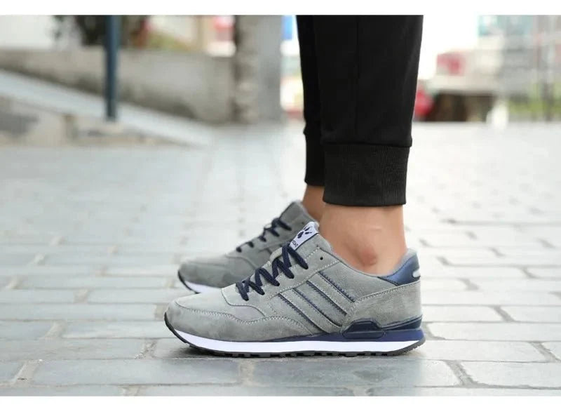 Men's luxury suede running sneakers by TrendLux Wear, breathable and anti-odor sport shoes with stylish design and cushioned sole.