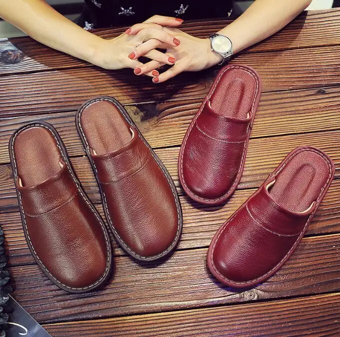 Unisex leather indoor slippers by TrendLux Wear with non-slip soles, available in EU sizes 35-46, shown in black with cushioned design.