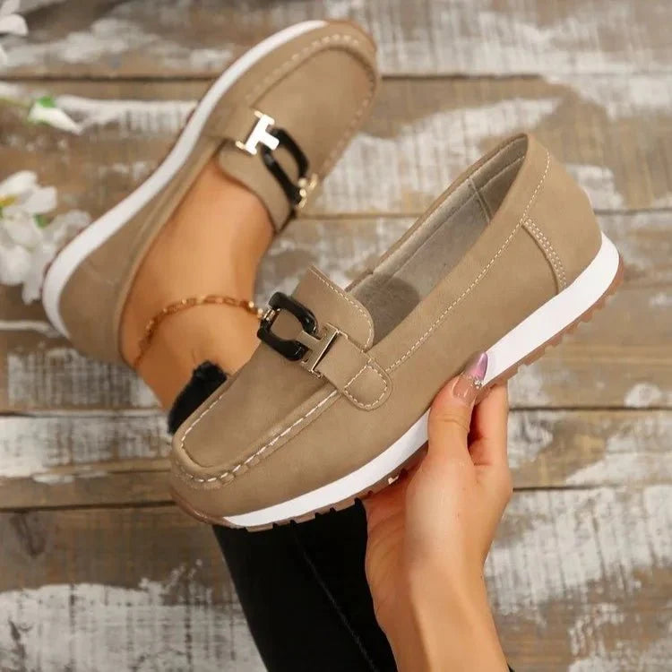 Women's slip-on flat shoes with buckle detail from TrendLux Wear, featuring a comfortable and stylish design.