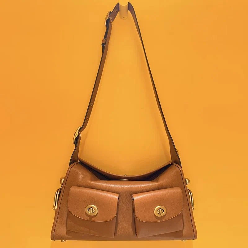 Women's vintage leather handbag by TrendLux Wear with large capacity and classic design, featuring sturdy handles and spacious interior.