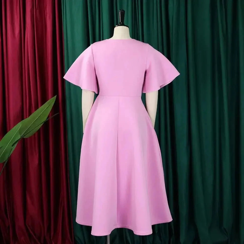 Women's high waist flare sleeve pleated A-line midi dress by The Glow Sanctuary, shown with a flowy silhouette and stylish mid-length design.