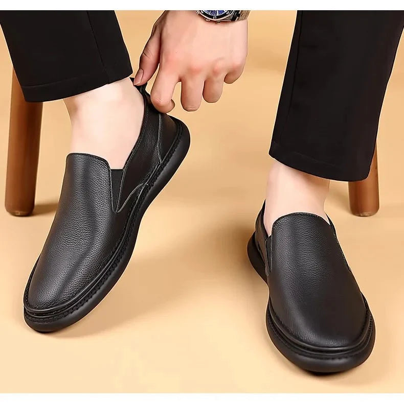 Men's genuine leather casual loafers by TrendLux Wear, breathable slip-on flat shoes in solid color with comfortable design.