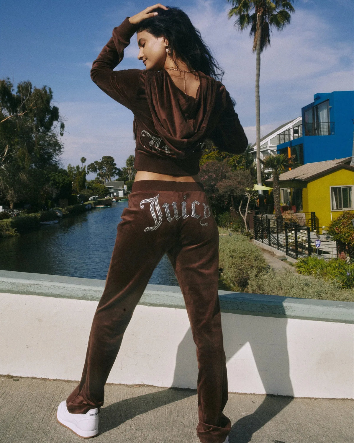 Women's Y2K two-piece hooded tracksuit by TrendLux Wear, featuring a long-sleeve jacket and flare jogger pants in size S to XL.