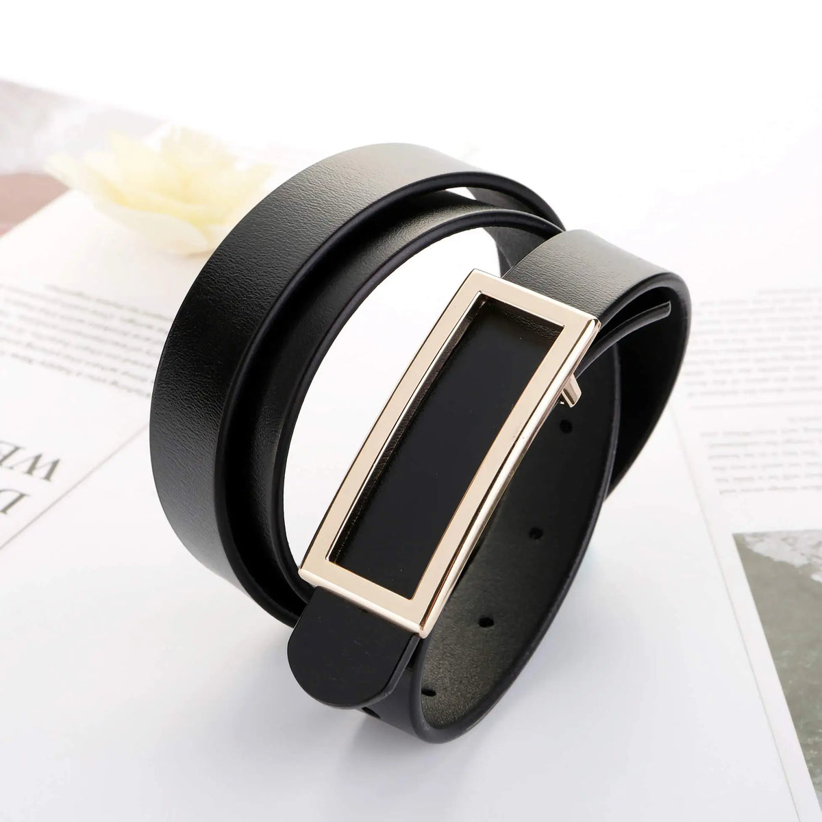 Women's genuine leather belt with metal buckle, adjustable strap for jeans and dresses, by TrendLux Wear.