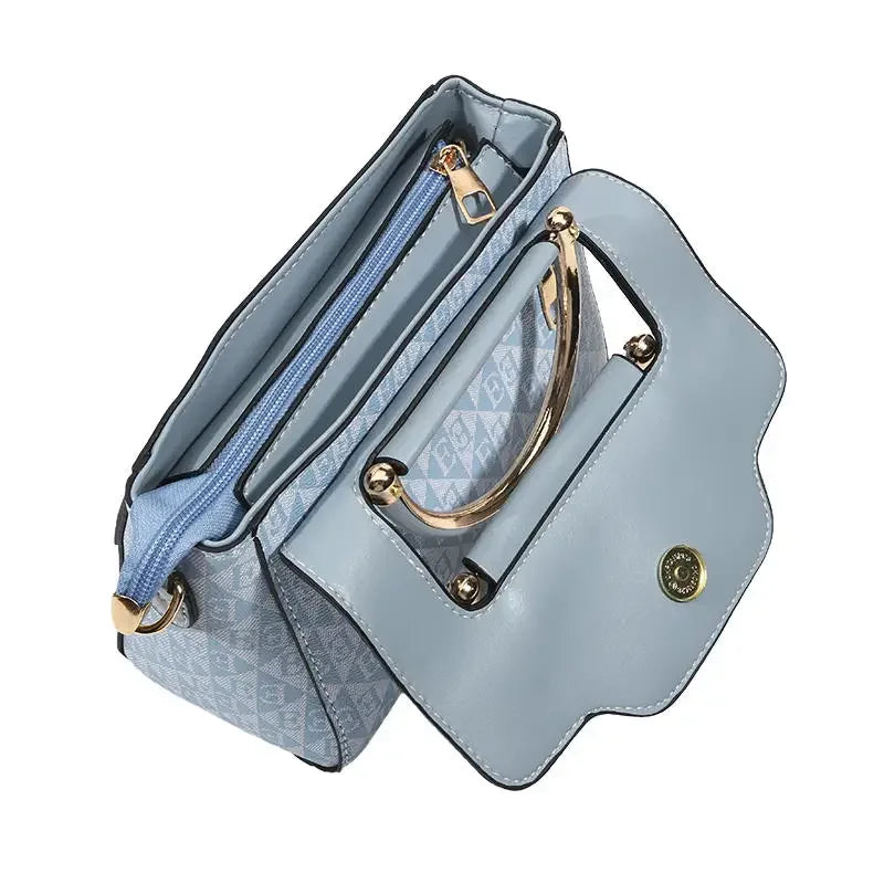 Light blue handbag with a gold handle and zip closure, featuring a textured interior and a rectangular shape.