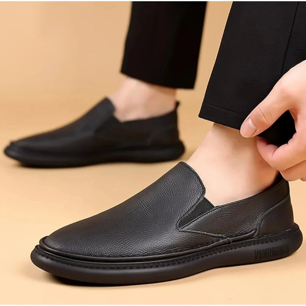 Men's genuine leather casual loafers by TrendLux Wear, breathable slip-on flat shoes in solid color with a sleek, comfortable design.