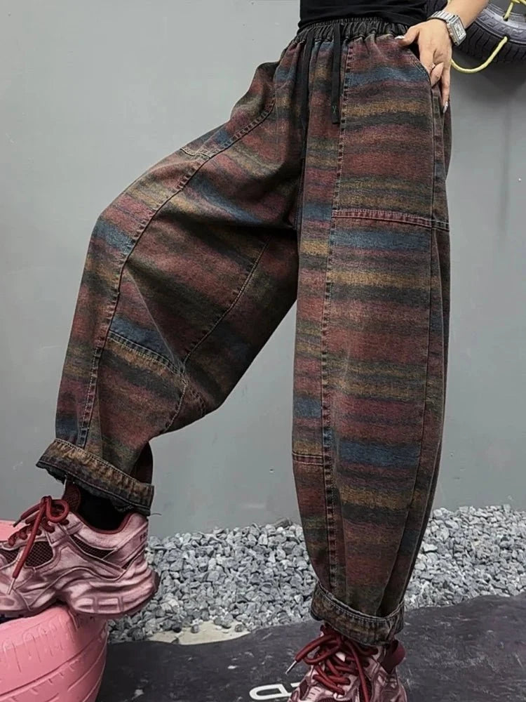 Women's Korean style striped harem jeans with loose elastic waist, denim trousers by TrendLux Wear, in a relaxed fit.