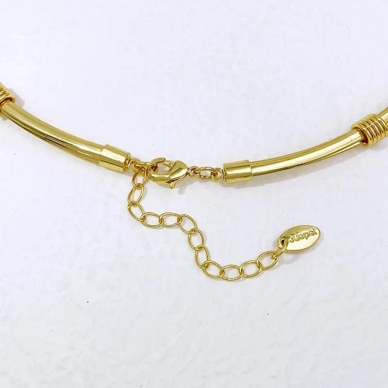 Women’s two-tone luxury jewelry set by TrendLux Wear featuring matching necklace and earrings with elegant gold and silver tones.