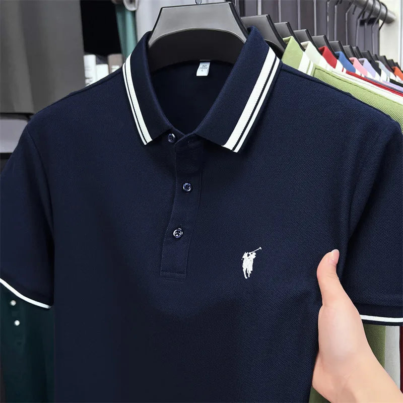 Navy blue short sleeve polo shirt featuring white striped collar and classic pony embroidery on the chest.