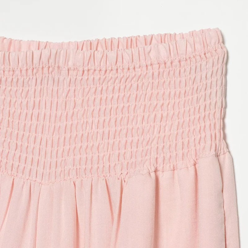Women's pink high waist wide-leg balloon pants by TrendLux Wear, shown with a relaxed fit and stylish design.