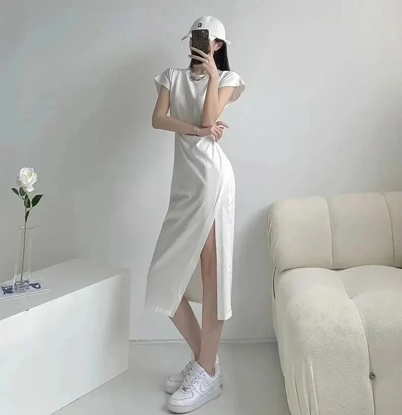 Y2K asymmetrical hem midi dress by The Glow Sanctuary, featuring a trendy street style design with a stylish, uneven hem.