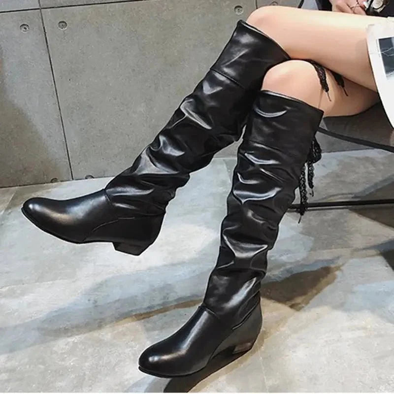 Women's pleated lace-up knee-high boots by TrendLux Wear, shown in black leather with a chunky heel and lace-up front.
