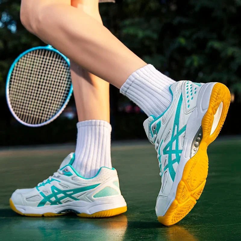 TrendLux Wear unisex athletic court sneakers with anti-slip soles, ideal for badminton and table tennis, shown in black and white.