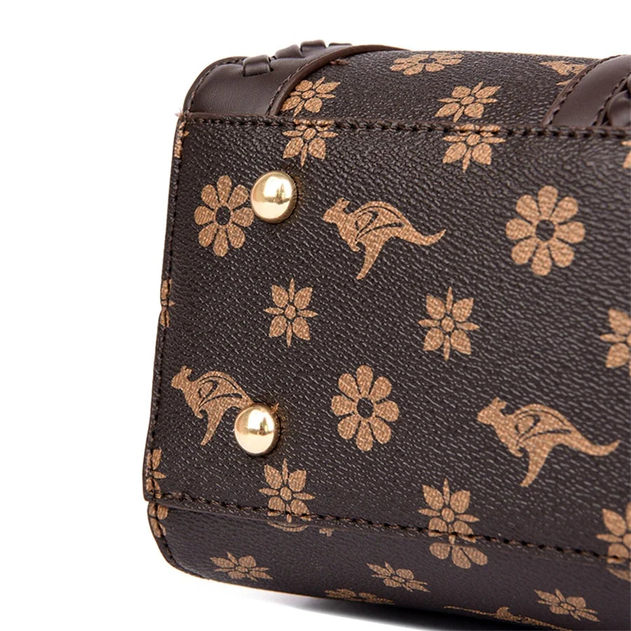 Brown handbag featuring a semi-woven style, adorned with gold floral and kangaroo prints, with gold hardware accents.