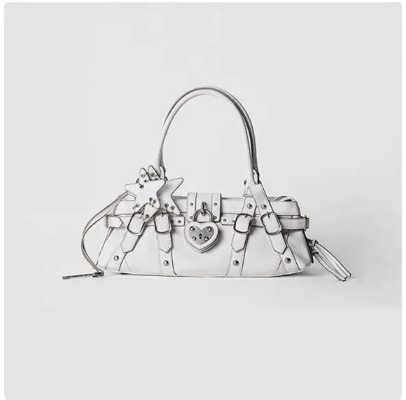 Rivet-decorated white microfiber leather handbag featuring a heart lock and star appliqué, styled as a crossbody bag.