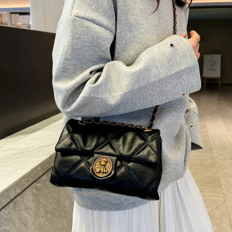 Women's luxury leather handbag with Lingge pattern by TrendLux Wear, featuring a sleek designer style and elegant craftsmanship.