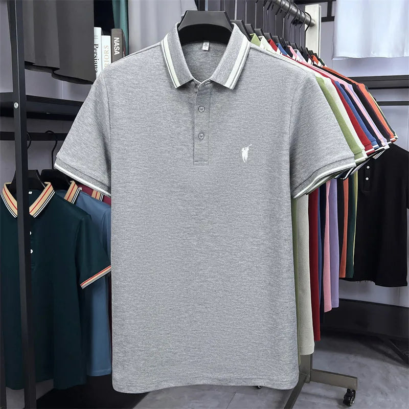 Gray short sleeve polo shirt with classic pony embroidery and striped collar, hanging among various color options.