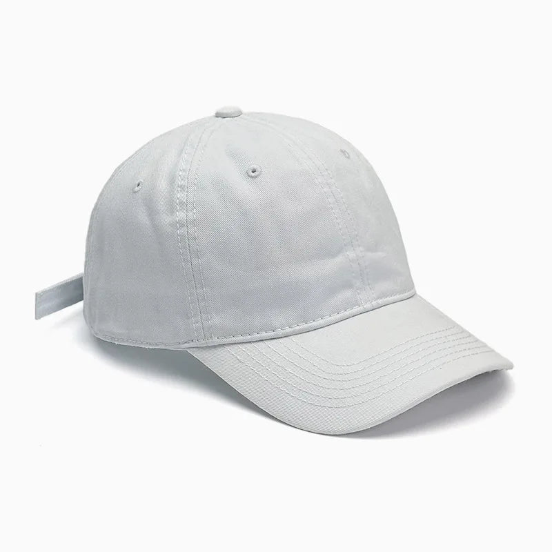 Unisex soft-top dad hat by TrendLux Wear, plain baseball cap with sun protection, available in 21 colors, shown in black.