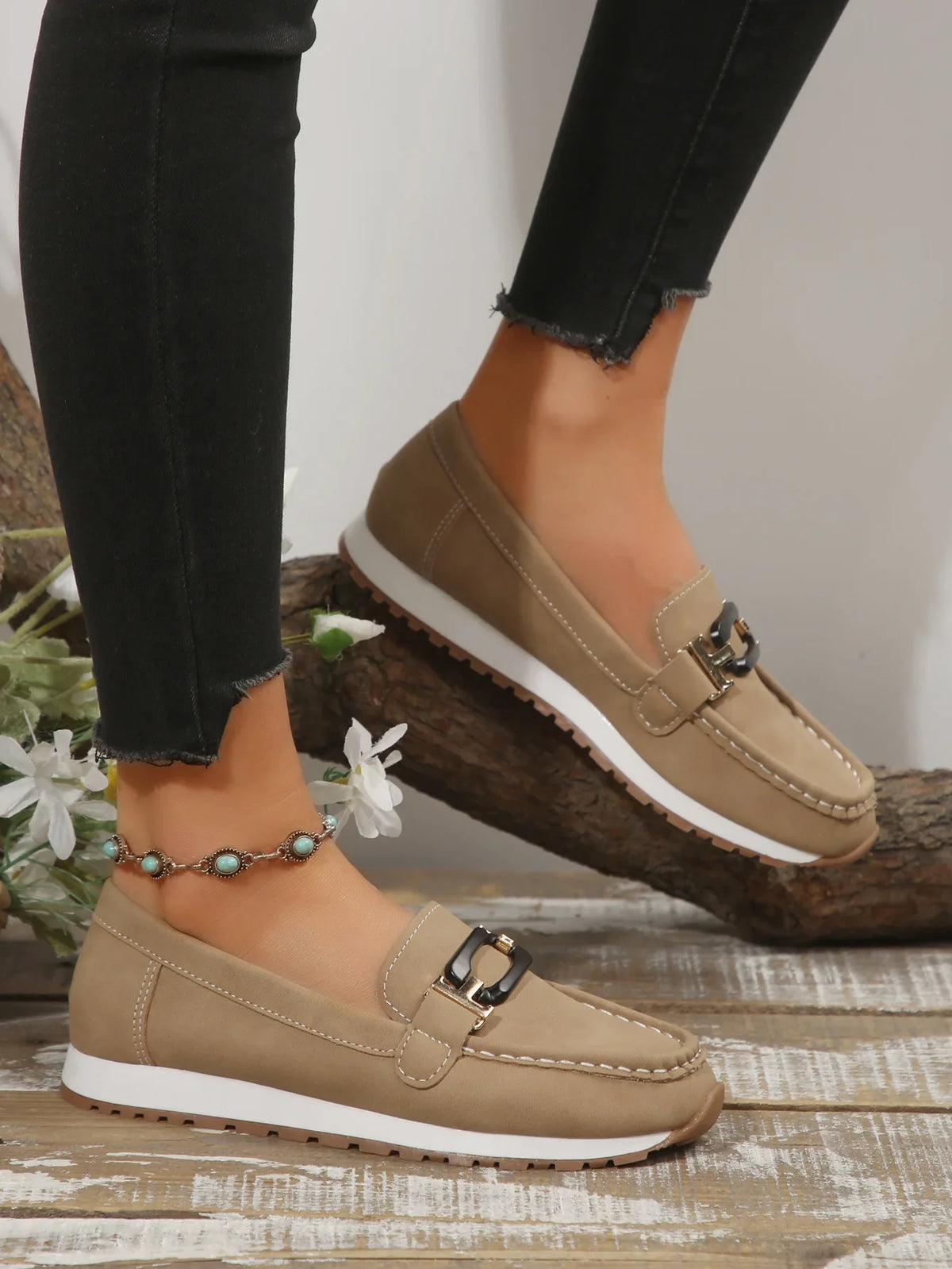 Women's slip-on flat shoes with buckle detail by TrendLux Wear, showcasing a stylish and comfortable footwear option.