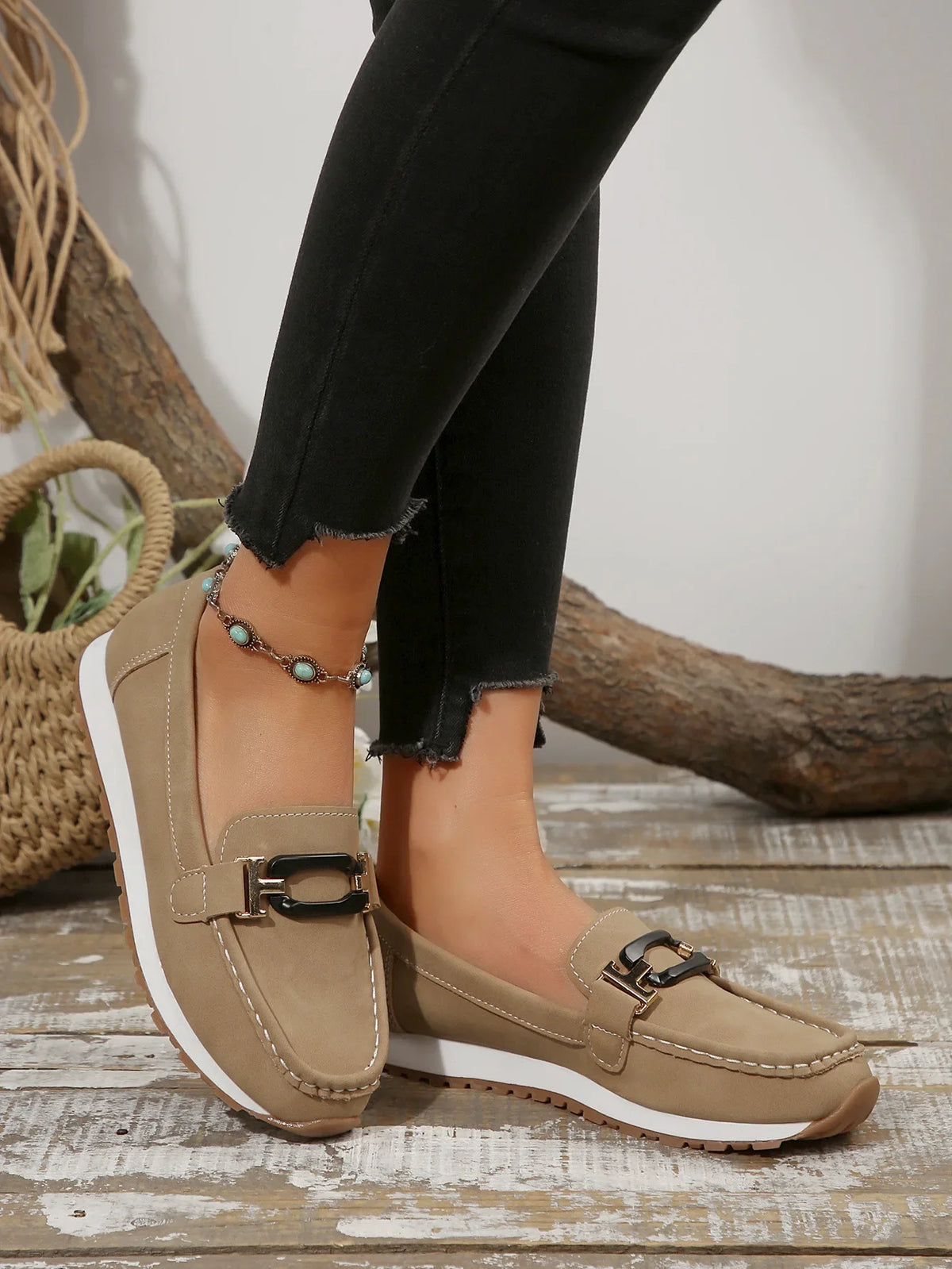 Women's slip-on flat shoes with buckle detail by TrendLux Wear, featuring a sleek, comfortable design for everyday wear.