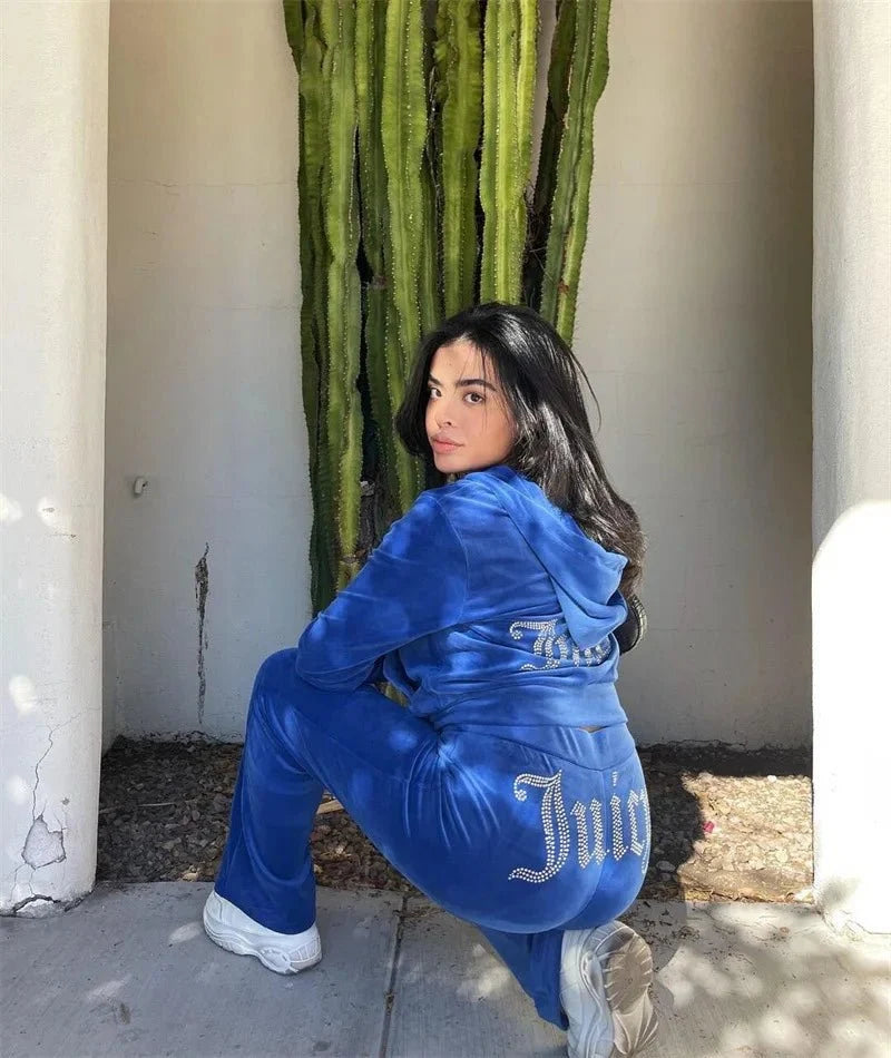 Women's Y2K two-piece hooded tracksuit by TrendLux Wear, featuring a long-sleeve jacket and flare jogger pants in size S to XL.