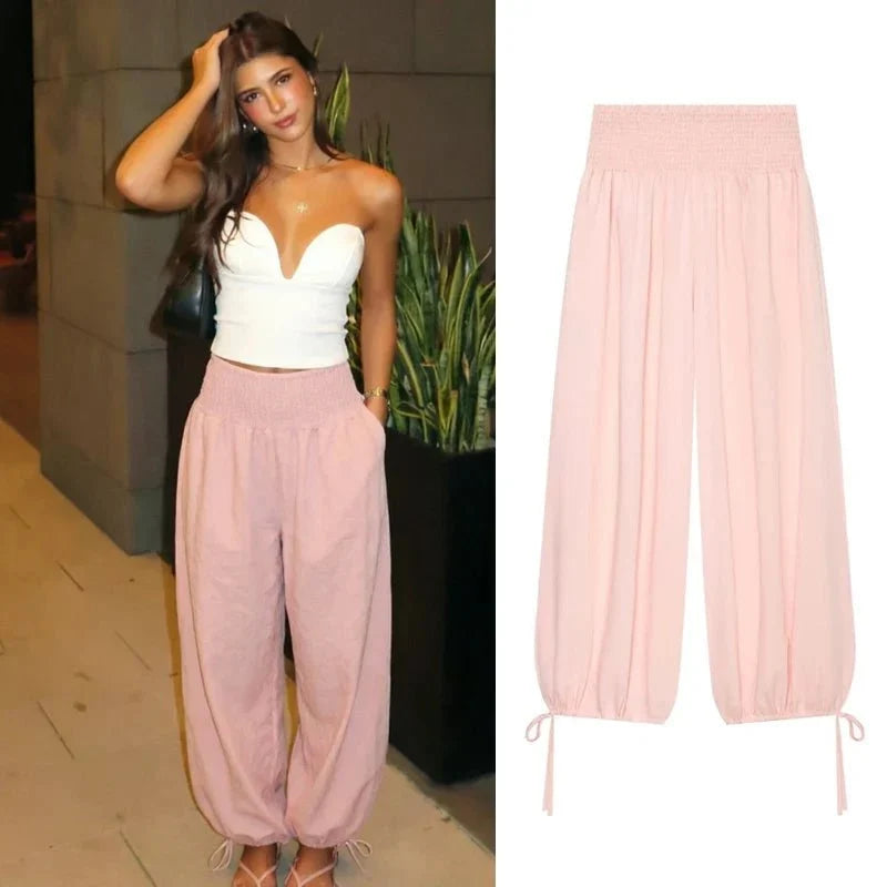 Women's pink high waist wide leg balloon pants by TrendLux Wear, showing the flowy, stylish design and comfortable fit.