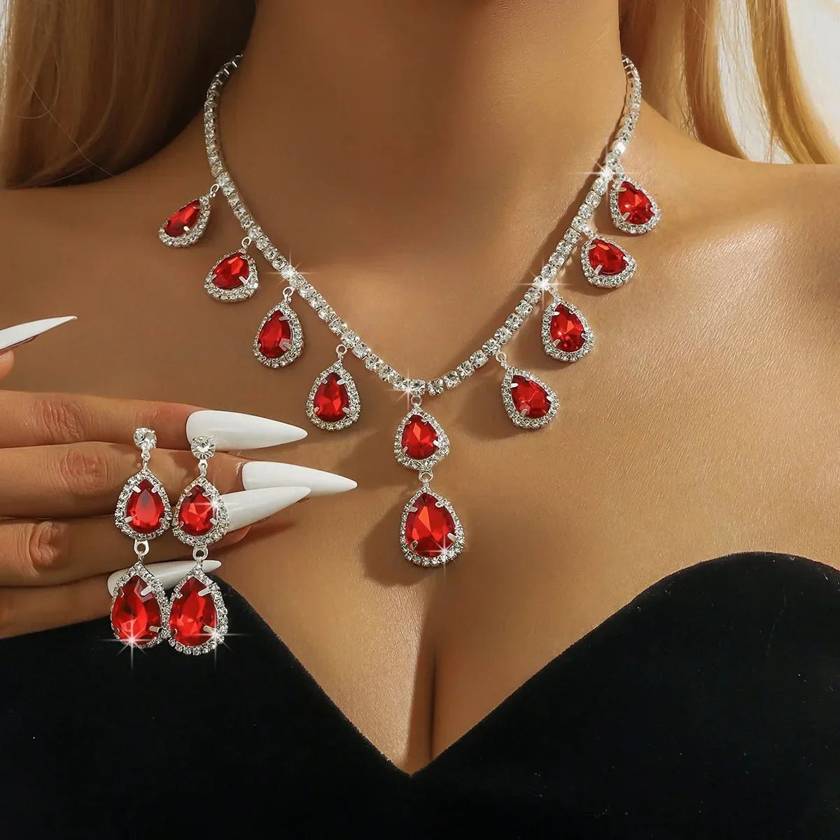TrendLux Wear women's jewelry set featuring a crystal pendant necklace and matching dangle earrings.