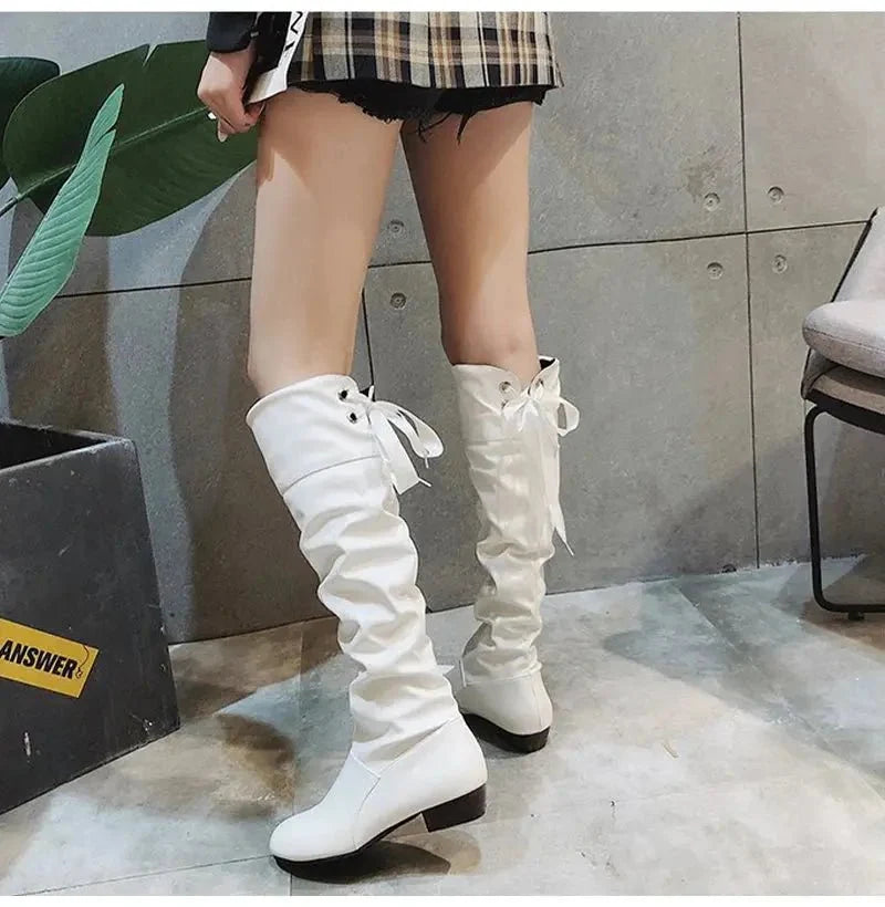 Women's pleated lace-up knee-high boots by TrendLux Wear, stylish leather shoes with chunky heels and lace-up fronts.