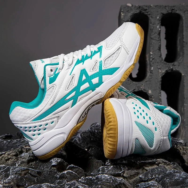Unisex TrendLux Wear anti-slip court sneakers for badminton and table tennis, with breathable mesh and rubber outsole for grip.