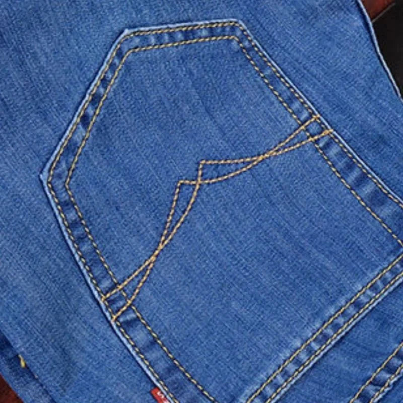 Men's elastic straight leg jeans by TrendLux Wear in classic blue and black, casual work denim with size options 28–40.
