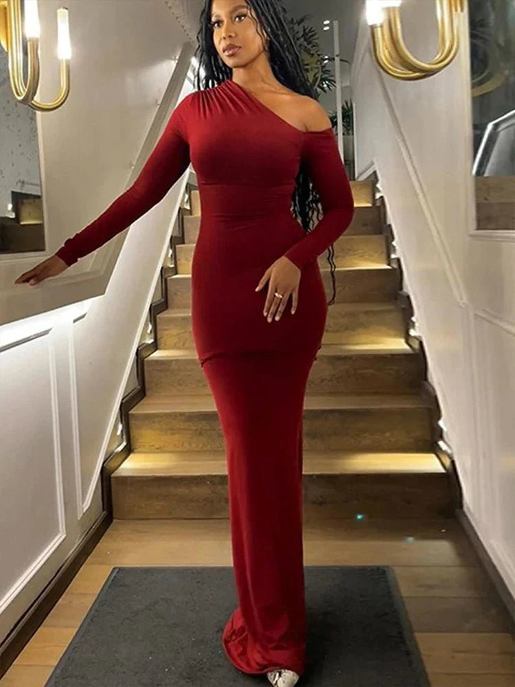 Women's black polyester-elastane knit one-shoulder backless slim club dress by The Glow Sanctuary, showcasing its stylish design.
