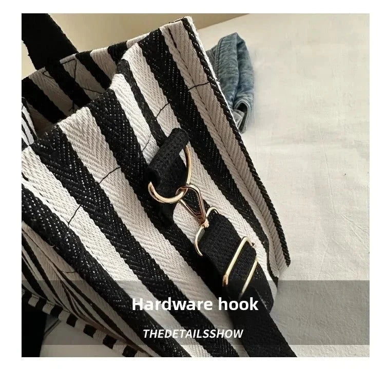 Large capacity striped women's shoulder handbag by TrendLux Wear, showing its stylish design and spacious interior.