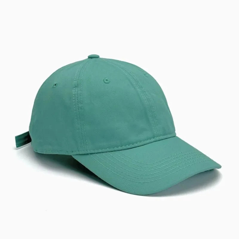 Unisex Soft-Top Dad Hat by TrendLux Wear in plain style with sun protection, available in 21 colors, shown in black.