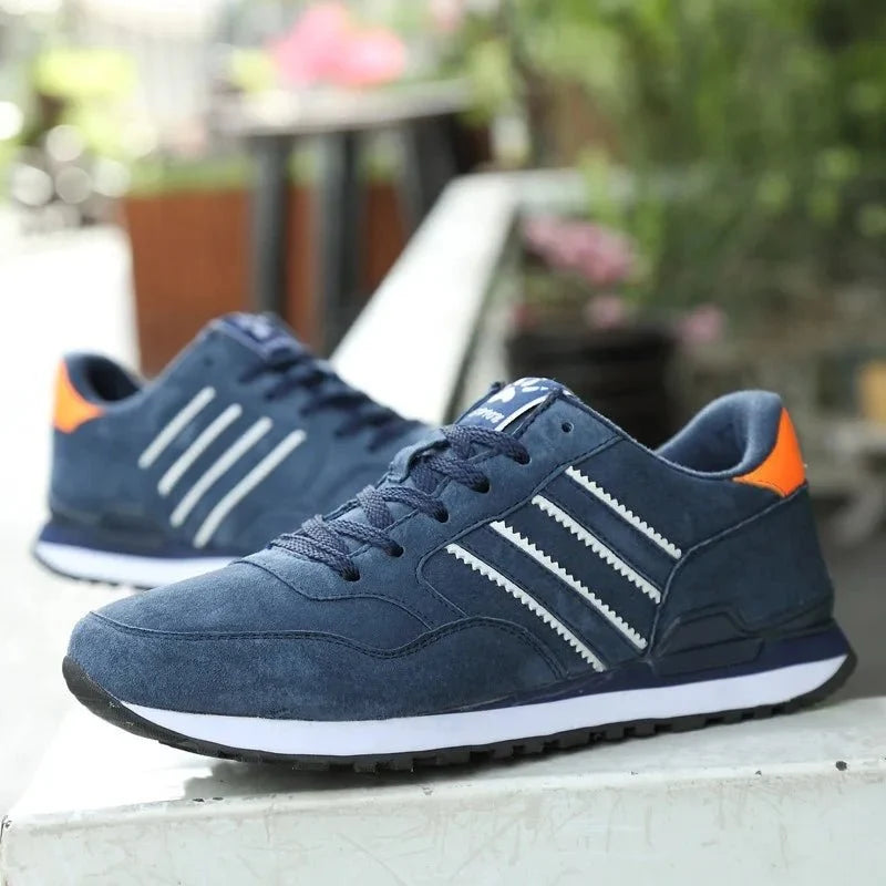 Men's luxury suede running sneakers by TrendLux Wear featuring breathable mesh, anti-odor insoles, and stylish sport shoe design.