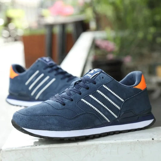 Men's luxury suede running sneakers by TrendLux Wear featuring breathable mesh, anti-odor insoles, and stylish sport shoe design.