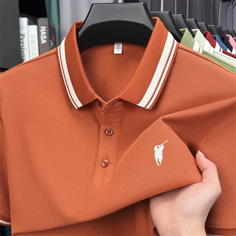 Short sleeve polo shirt in burnt orange with white striped collar and embroidered pony logo, made from breathable cotton.