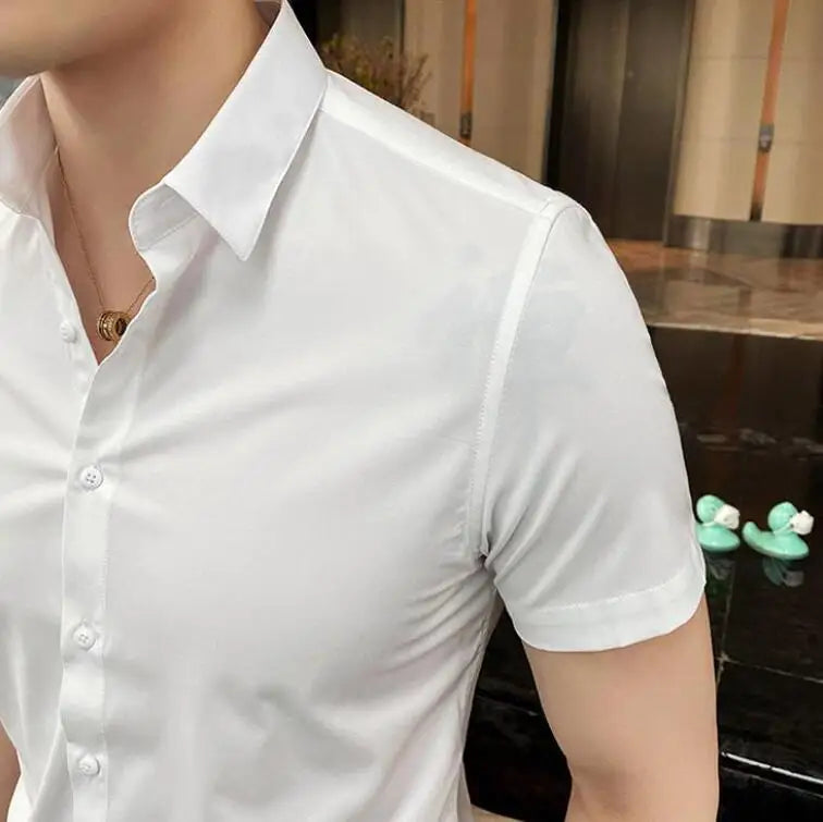 Short sleeve white shirt with a square collar, fitted on a model showcasing a casual yet polished look.