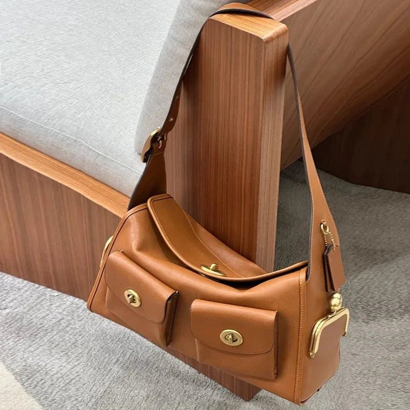 Women's vintage leather handbag with large capacity, TrendLux Wear's stylish pure leather tote featuring sturdy handles and spacious interior.