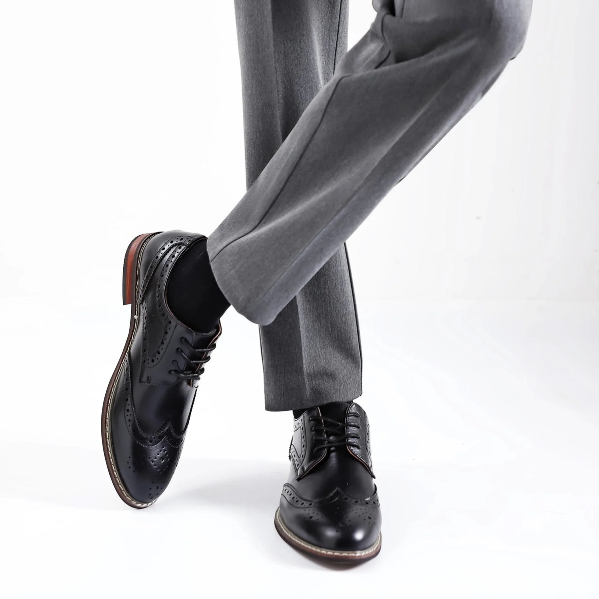 Men's black and brown leather lace-up brogue dress shoes by TrendLux Wear, formal business oxfords with detailed perforations.