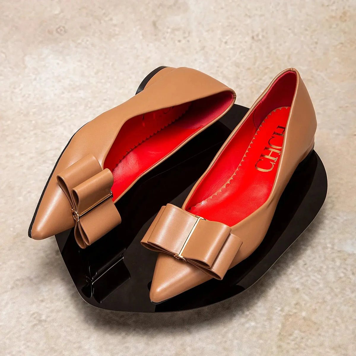 Women's pointed-toe bow flat shoes by TrendLux Wear, featuring sleek design and comfortable flats with elegant bow detail.