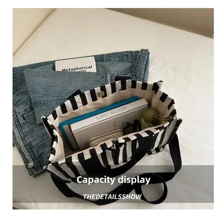 Women's large capacity striped shoulder handbag by TrendLux Wear, showing the stylish design and spacious interior.