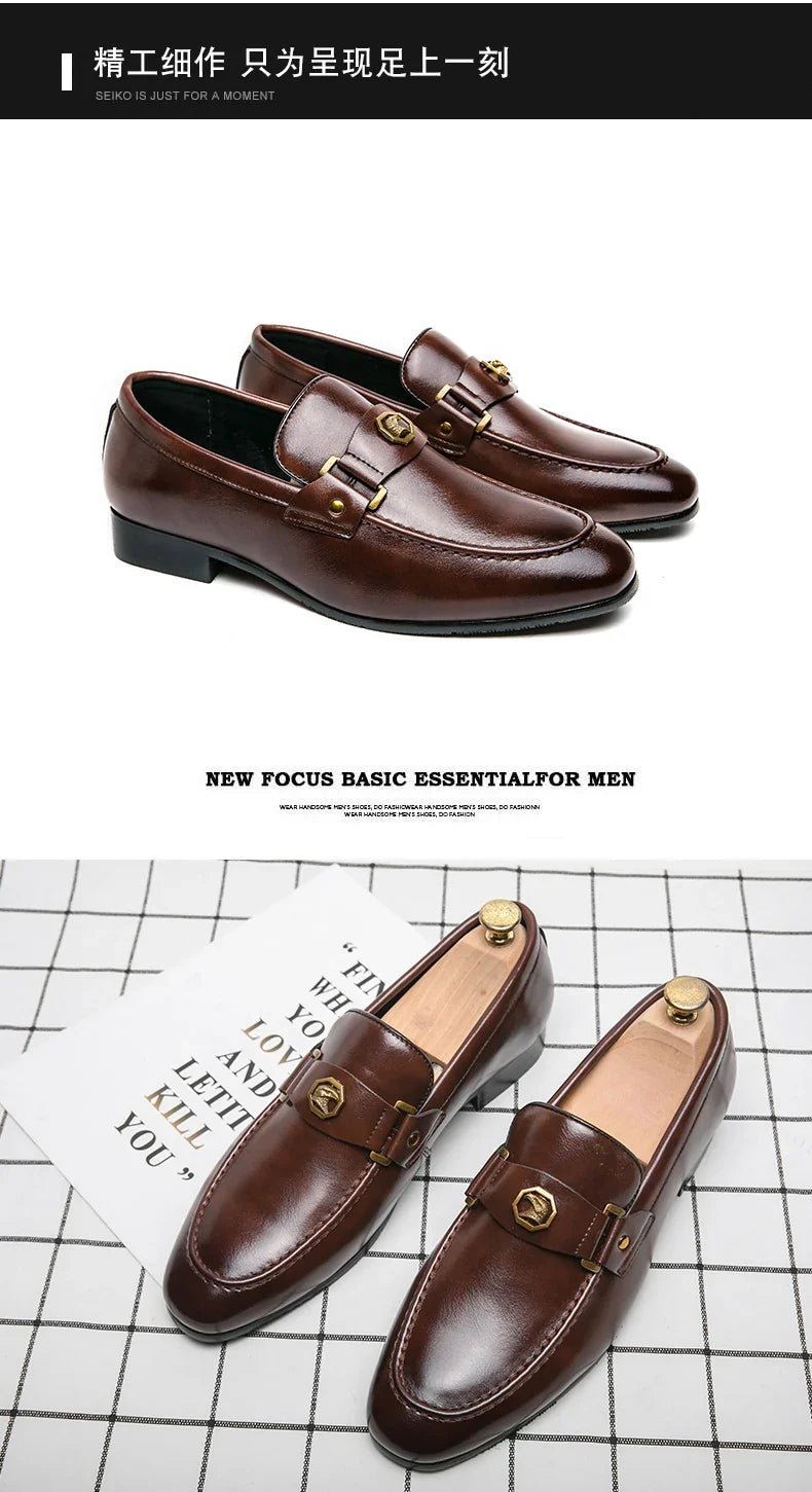 Brown leather slip-on loafers with a metal buckle detail, featuring a round toe and a smooth surface.
