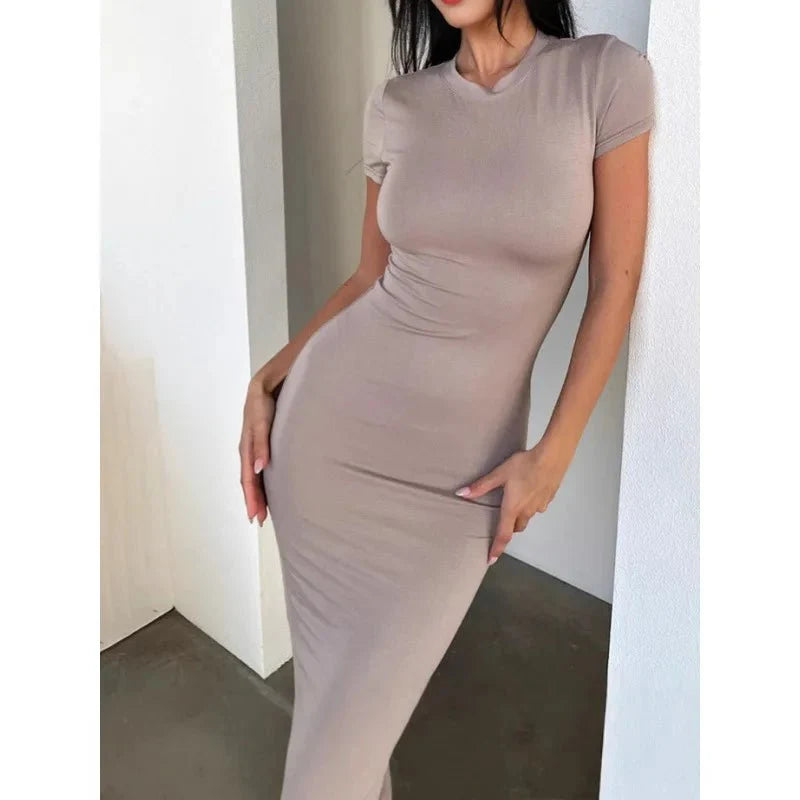 Women's polyester-elastane long sleeve dress by The Glow Sanctuary, shown in a stylish, fitted design suitable for various occasions.