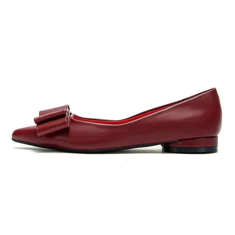 Women's pointed-toe bow flat shoes by TrendLux Wear, stylish slip-ons with elegant bow detail and sleek design.
