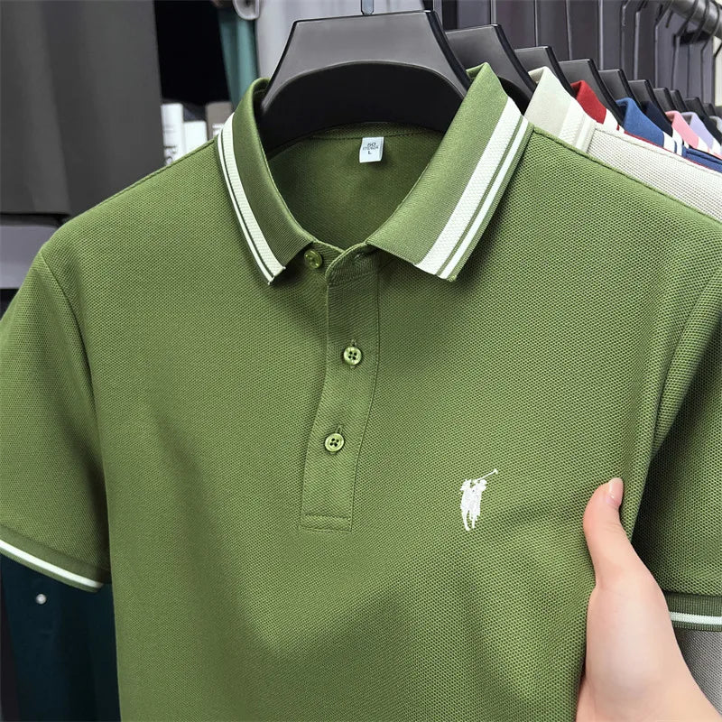 Short sleeve polo shirt in olive green with white striped collar and small embroidered pony logo.