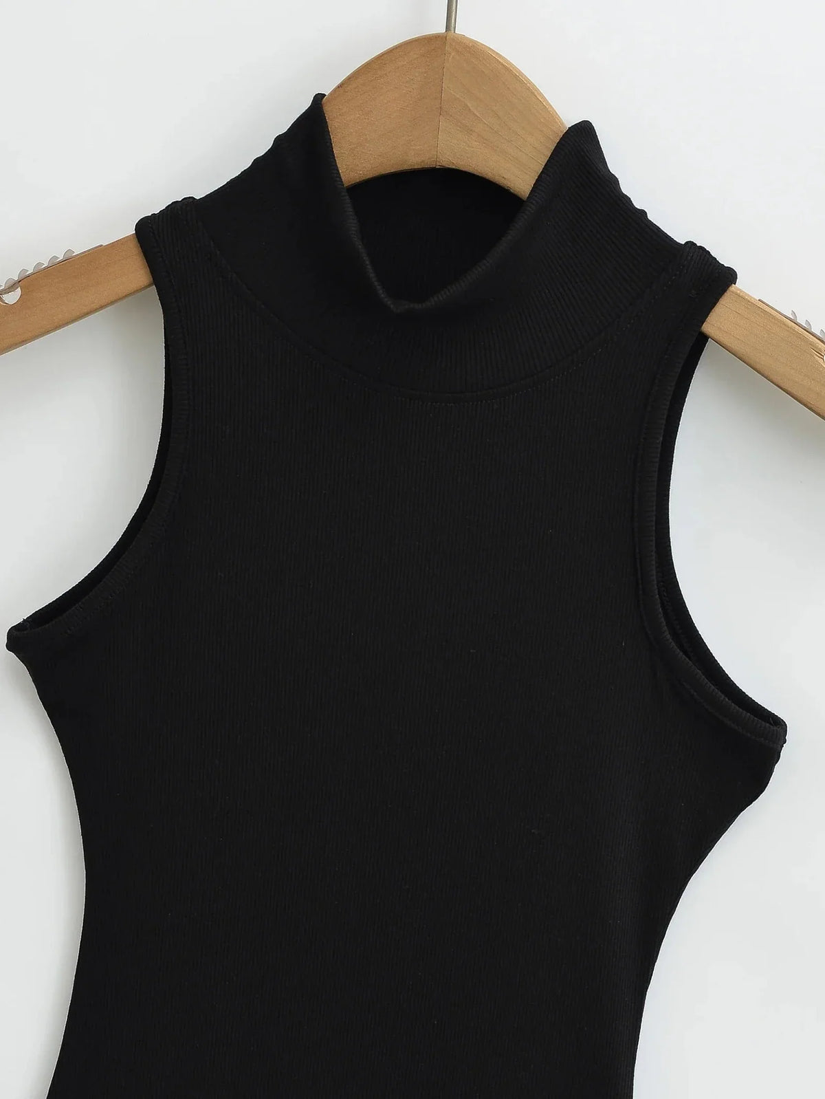 Women's knit turtleneck bodycon maxi dress by The Glow Sanctuary, featuring a fitted ankle-length design in textured knit fabric.