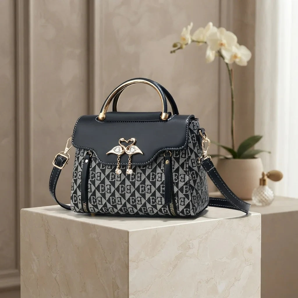 Versatile ladies' handbag in navy with embossed pattern, gold accents, and a convertible strap for shoulder or crossbody wear.
