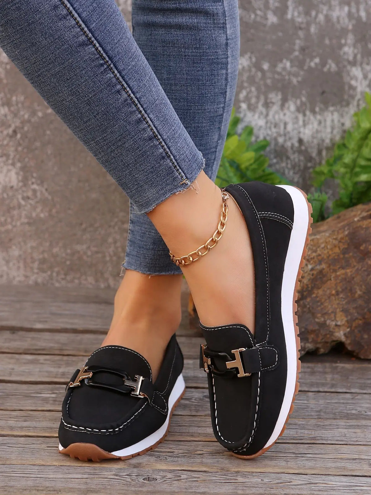 Women's slip-on flat shoes with buckle detail from TrendLux Wear, featuring a sleek design and comfortable fit.