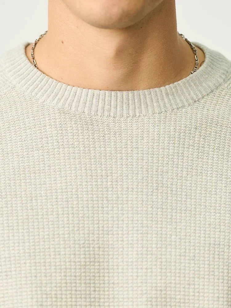 Men's oversized waffle-knit crewneck sweater in Heather Denim Blue from TrendLux Wear, casual pullover with textured knit fabric.